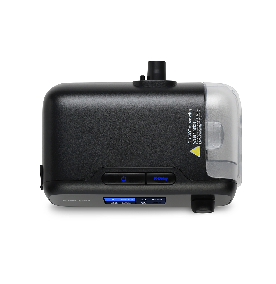Close-up of the Kricket device showing its control buttons and attached humidifier tank